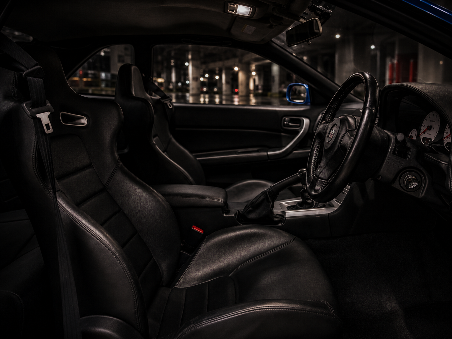 Wide interior view of a Nissan Skyline GT-R R34 cabin