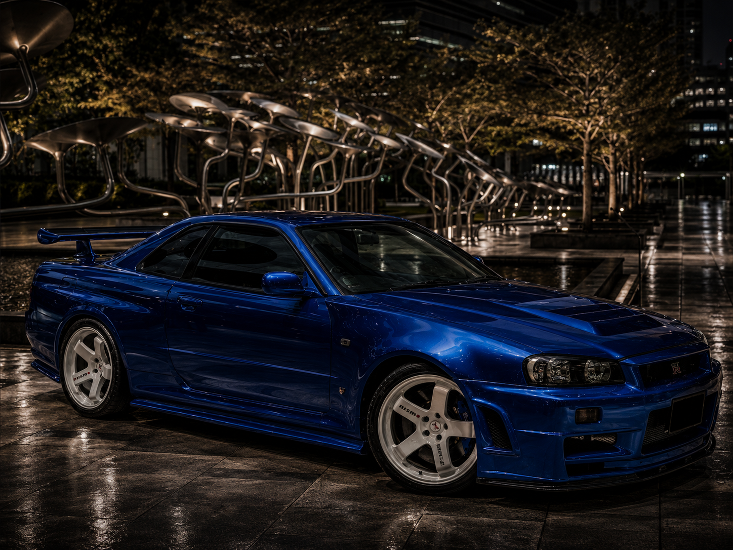 Blue Nissan Skyline GT-R R34 front three-quarter view